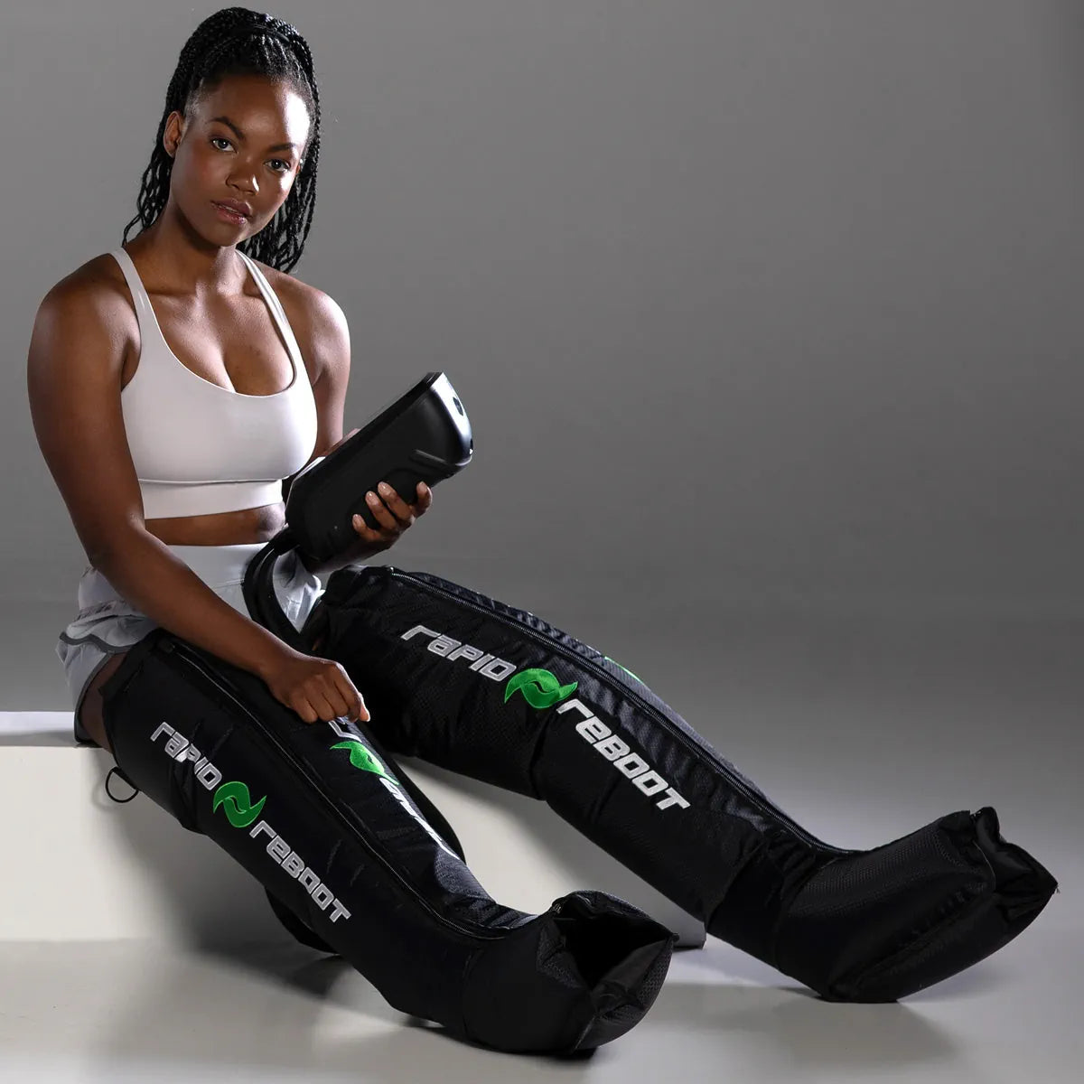 Athlete using Rapid Reboot REGEN boots during a recovery session