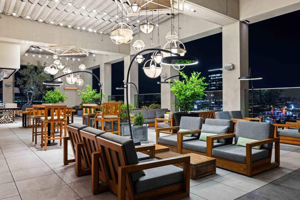 Bromic Eclipse heater on rooftop bar with nighttime city skyline