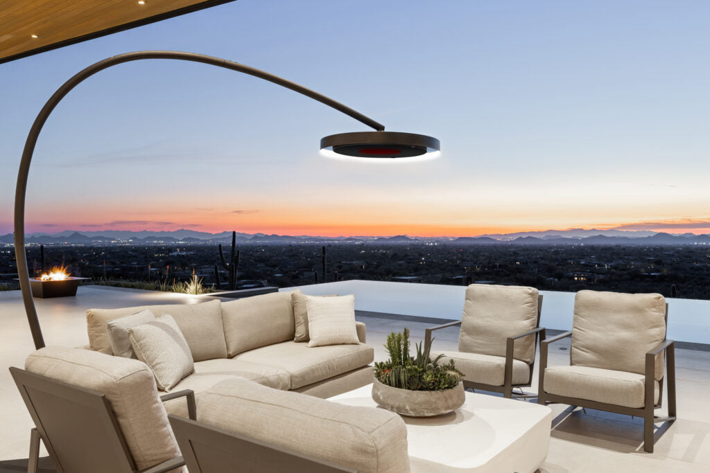 Bromic Eclipse heater installed beside open-air luxury patio at dusk