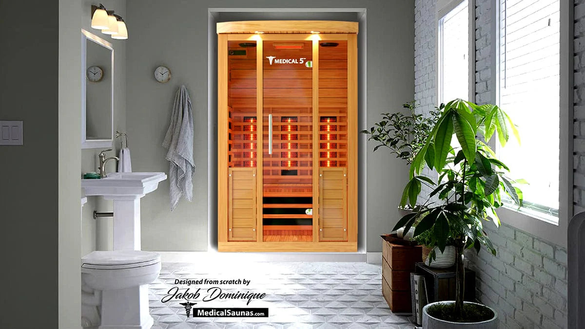 Infrared sauna in a modern bathroom with a plant and sink.