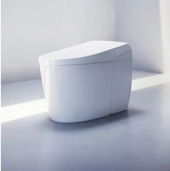“TOTO Neorest AS smart bidet toilet in modern white bathroom, angled front view.”