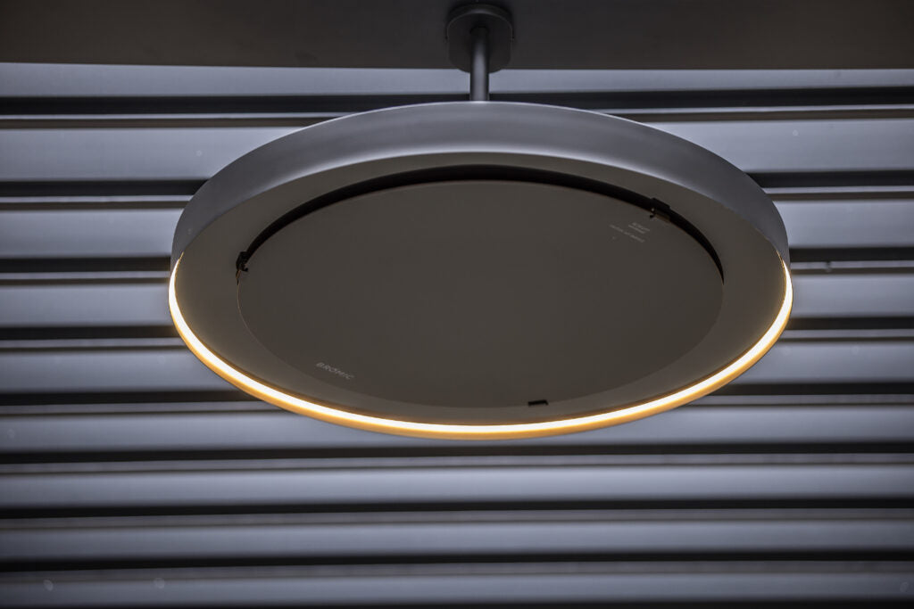 Angle view – close-up of the heater showing housing and mounting pole