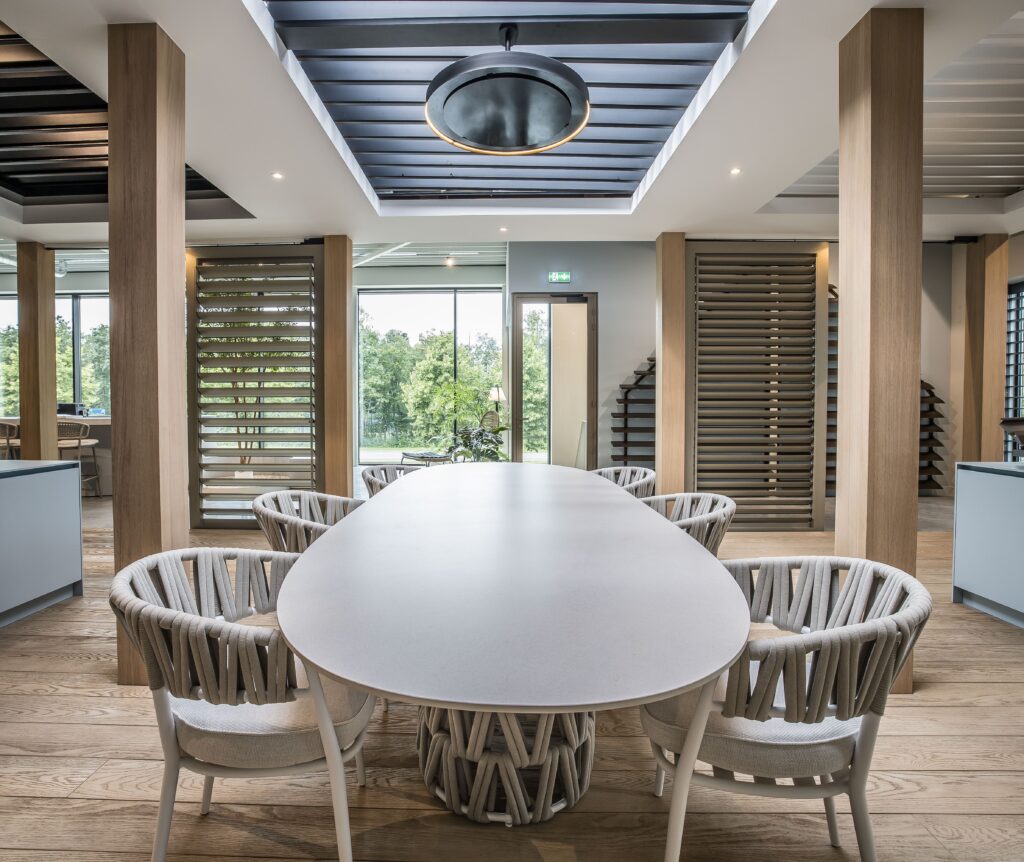 Main hero image – full view of heater mounted on patio ceiling overlooking dining area