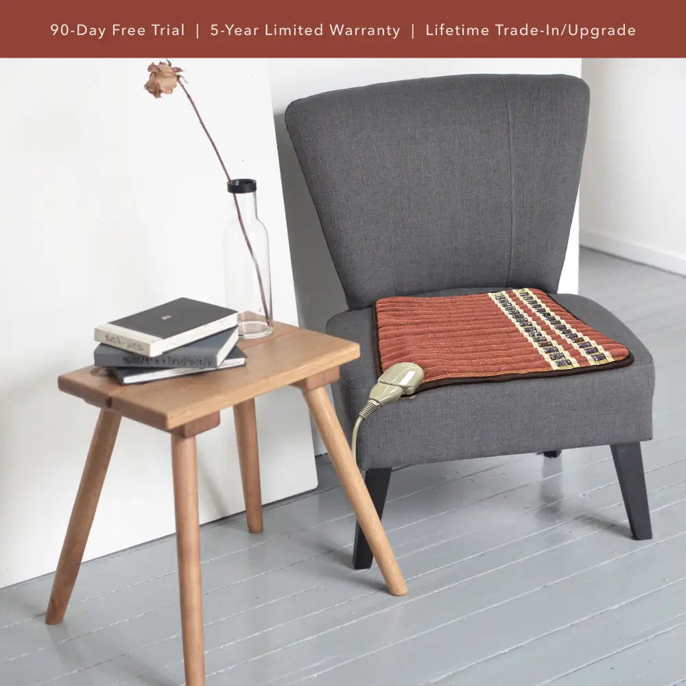 Lifestyle image of a TAO Chair mat placed on a modern gray chair.