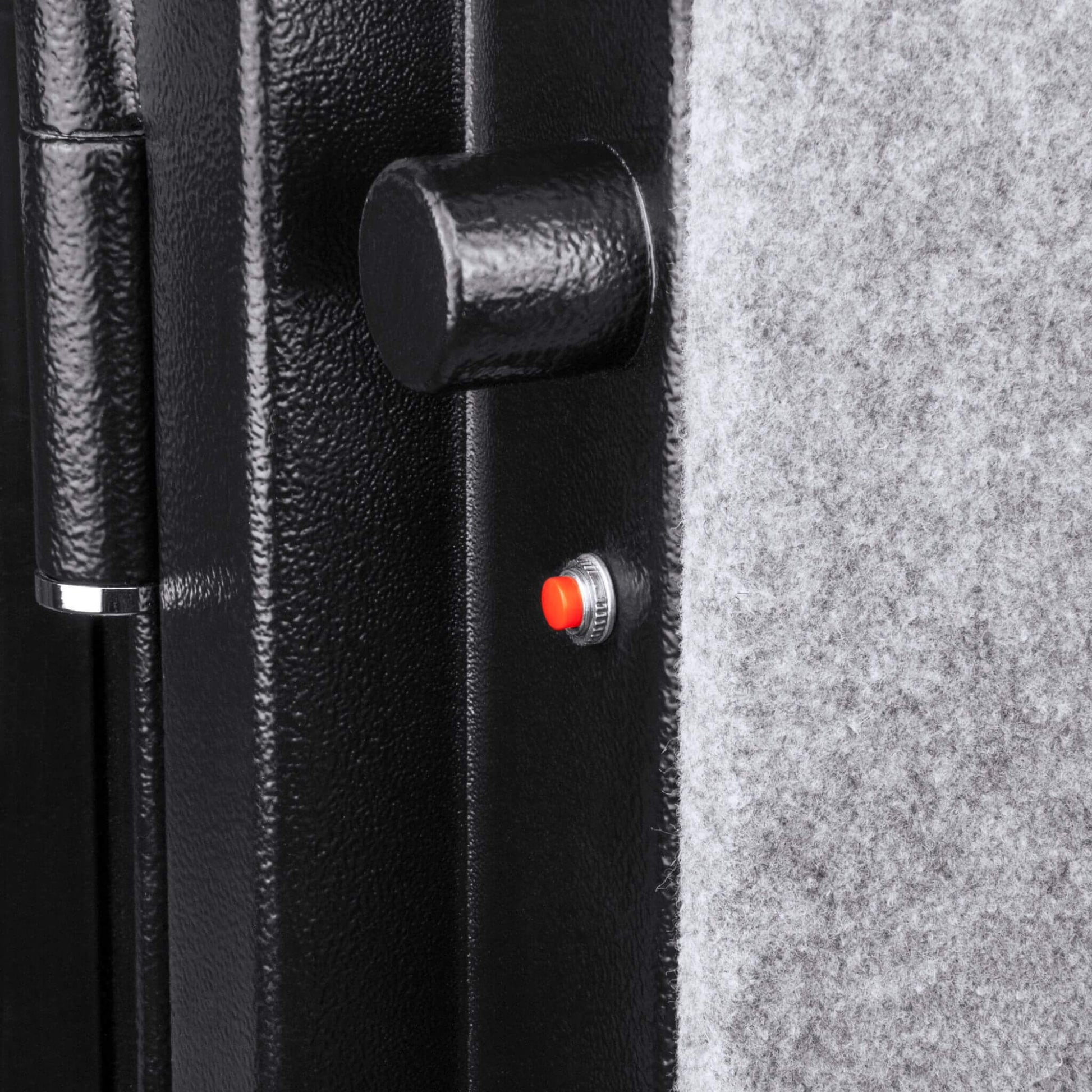 Close-up of Barska FV500 FireVault safe door showing solid steel locking bolt and interior carpeted panel with red indicator button