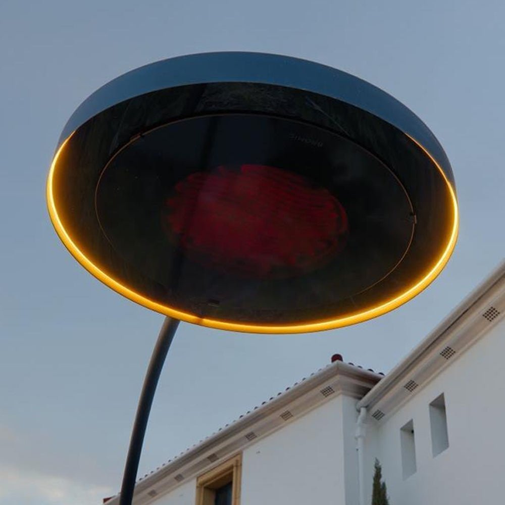 Upward angle close-up of Bromic Eclipse heating head showing black housing and warm LED halo