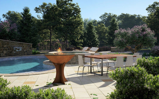 Arteflame XXL 40-inch Flat Top Grill with High Euro Base in Corten steel set up beside a pool in an outdoor patio environment.