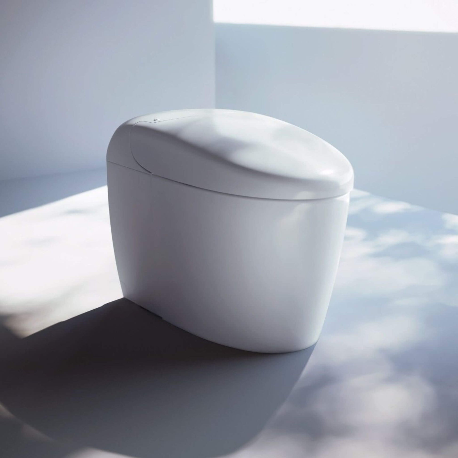 TOTO Neorest RS MS8341CUMFG smart toilet in Cotton shown in a modern bathroom setting