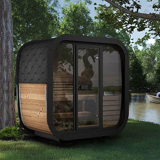 SaunaLife CL4G 3-person outdoor cube sauna placed beside a lake with full-glass front and Thermo-Spruce exterior