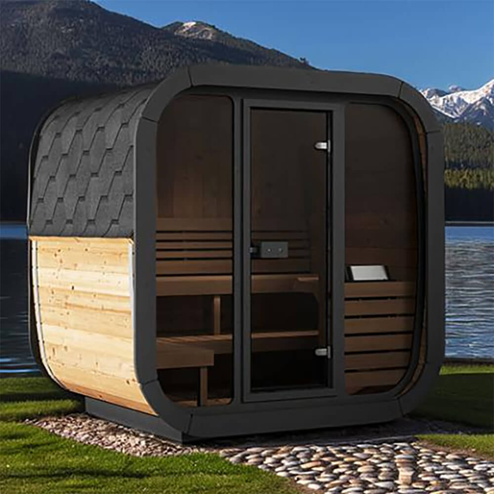 SaunaLife CL5G outdoor cube sauna with full bronze-tinted tempered glass front wall, set beside a lake with mountain views.