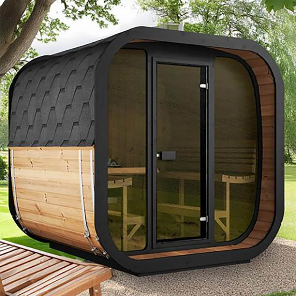 SaunaLife CL7G outdoor cube sauna with full bronze-tinted glass front wall and black shingle roof, set in a natural backyard environment.