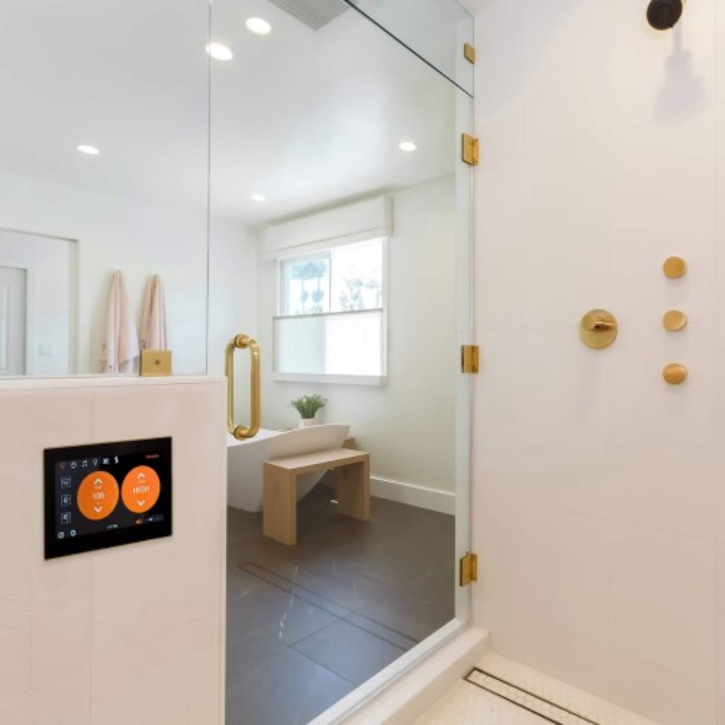 “ThermaSol ThermaTouch 10-inch control panel installed in a contemporary steam shower bathroom.”
